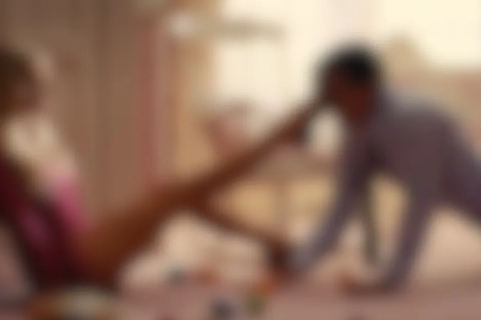 Catch Me If You Can 2002 scene: Blurred image of two figures, one reclining in pink, the other leaning towards a leg.