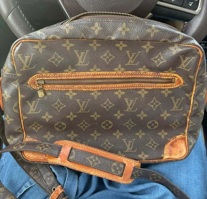A Louis Vuitton bag, a good thing found in the Goodwill bins. The iconic monogram pattern and leather details are visible.