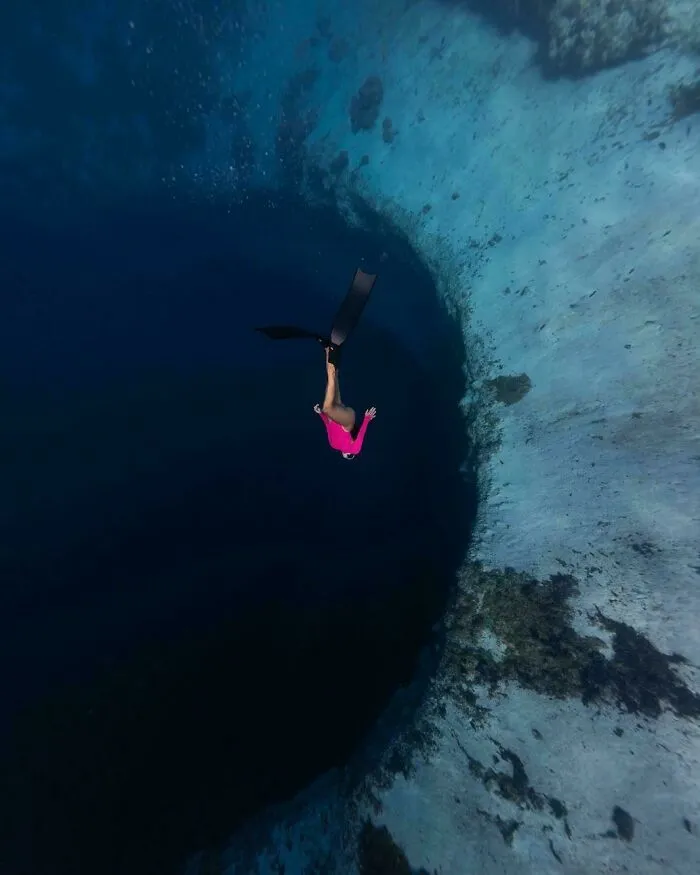 Swimming Into A Blue Hole In The Bahamas