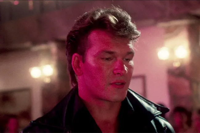 Actor Patrick Swayze in a classic movie scene, delivering the iconic line nobody puts Baby in a corner.