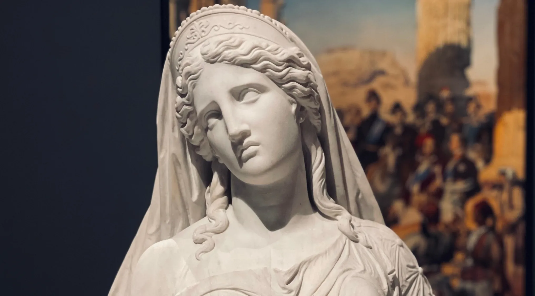 Marble statue of Penelope, the faithful wife of Odysseus, depicted with a calm and thoughtful expression.