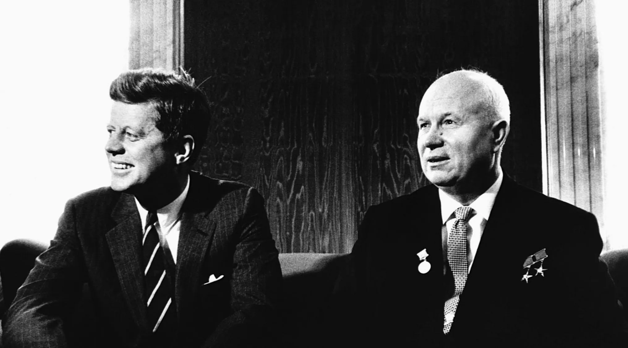 Black and white photo of two men in suits during the Cuban Missile Crisis nuclear war standoff in 1962.