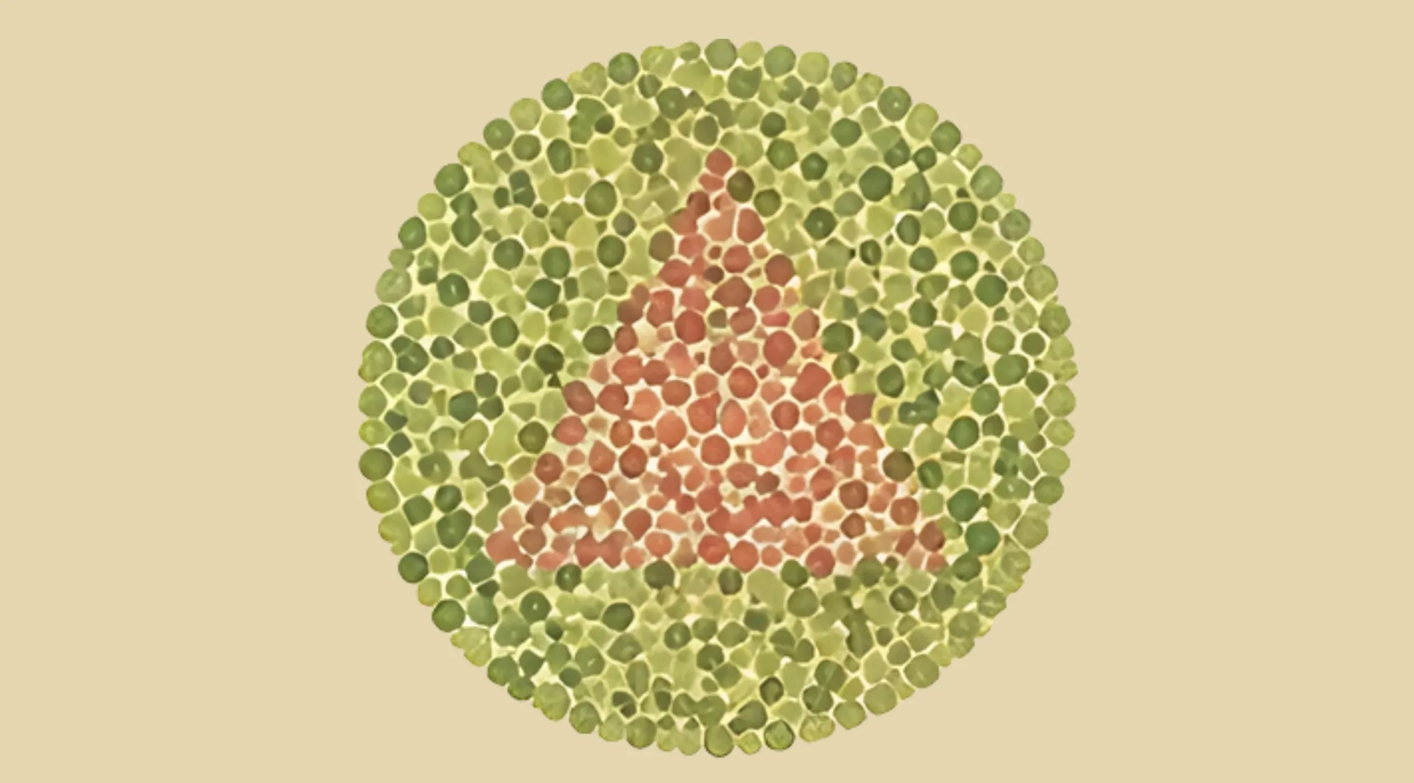 Color blindness test image showing a red triangle shape formed by colored dots against a green dotted background.