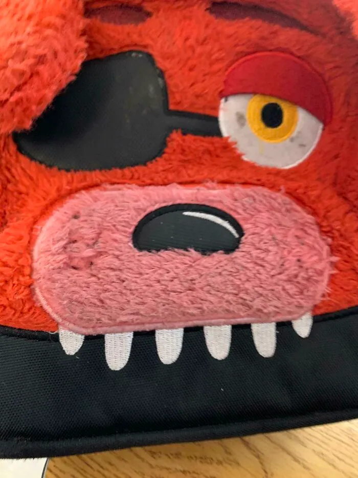 The Strap Goes Through His Eye