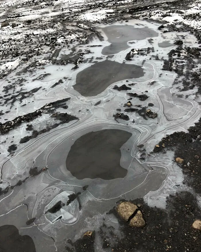 The Way This Picture Of A Frozen Puddle In My Backyard Looks Like A Landscape From The Perspective Of A Plane