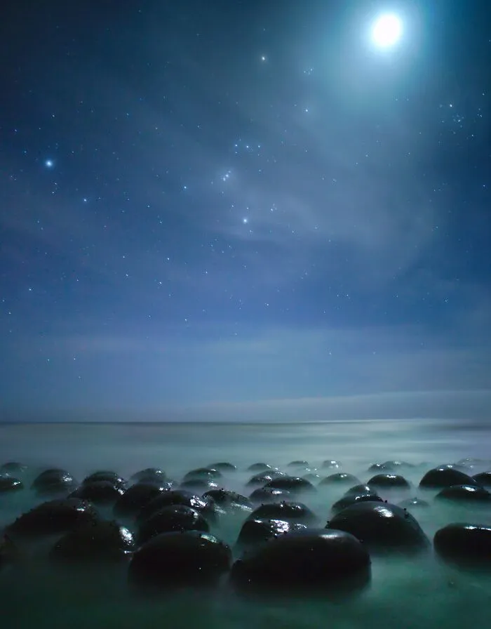 Moon And Orion Setting Over Alien-Looking Rocks On The Northern California Coast