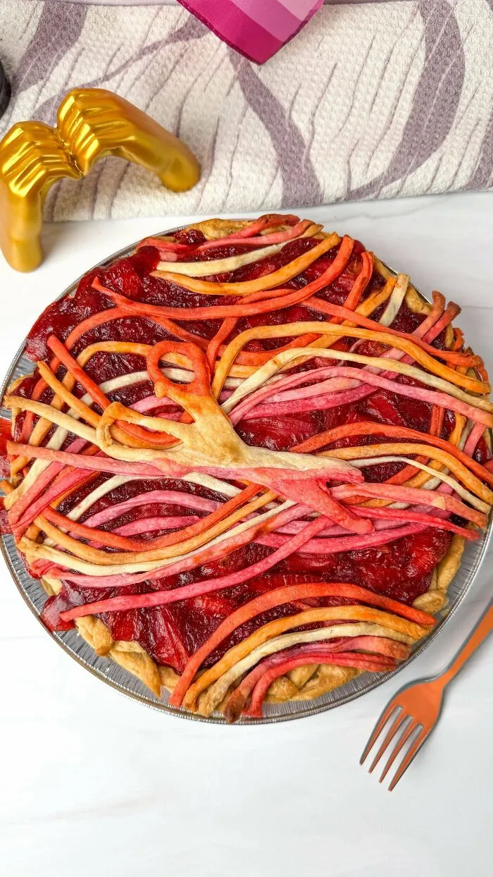 Colorful strawberry pie with artistic crust design
