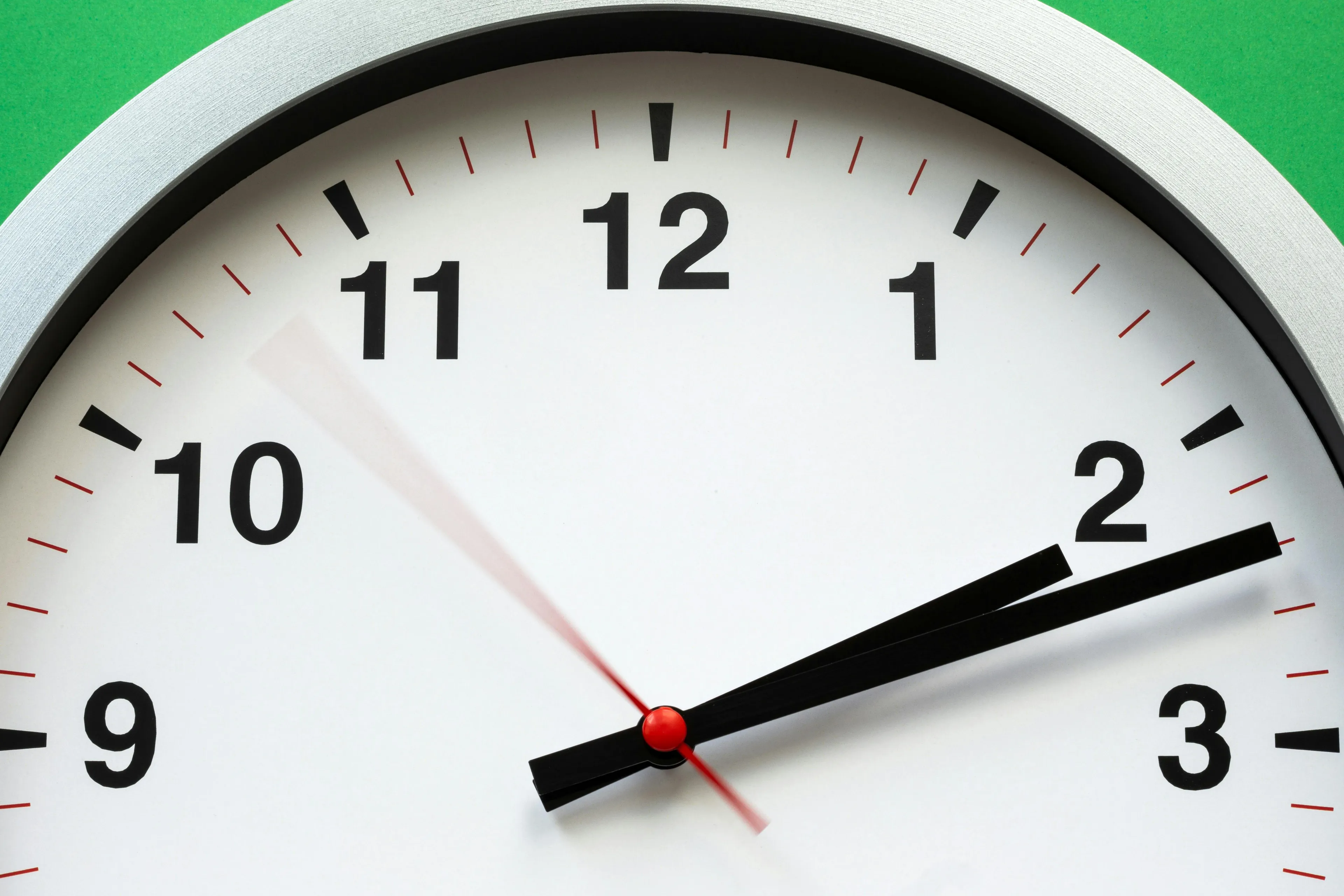 A close-up of a clock face with moving hands. Win trivia night and learn how many minutes are there in a day.