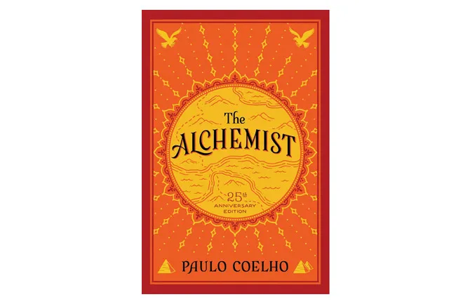 The Alchemist book cover, a vivid orange and red design, perfect for a book to reread.