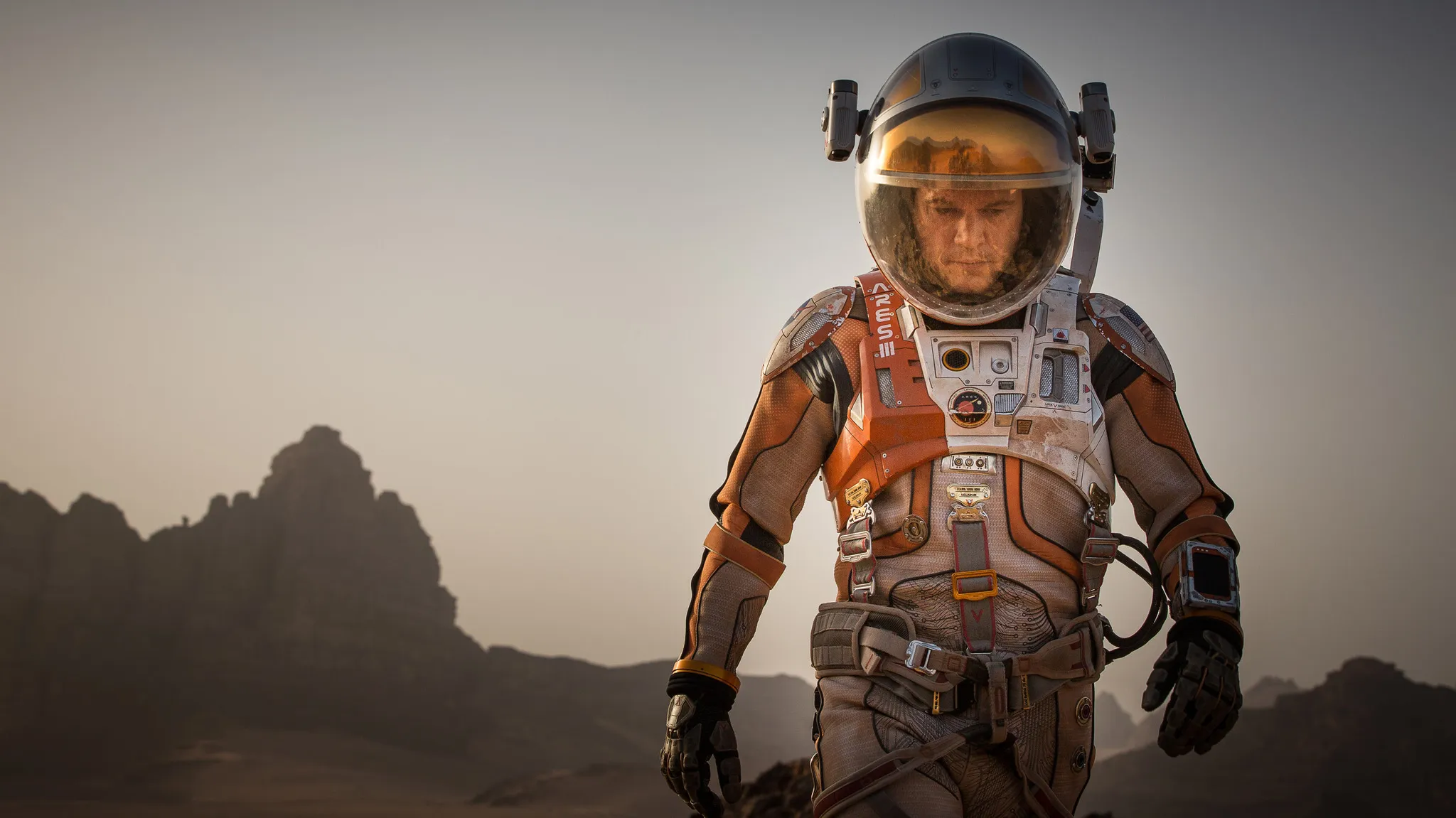 Matt Damon as Mark Watney in a spacesuit on Mars, a comfort movie like The Martian for a tough day.