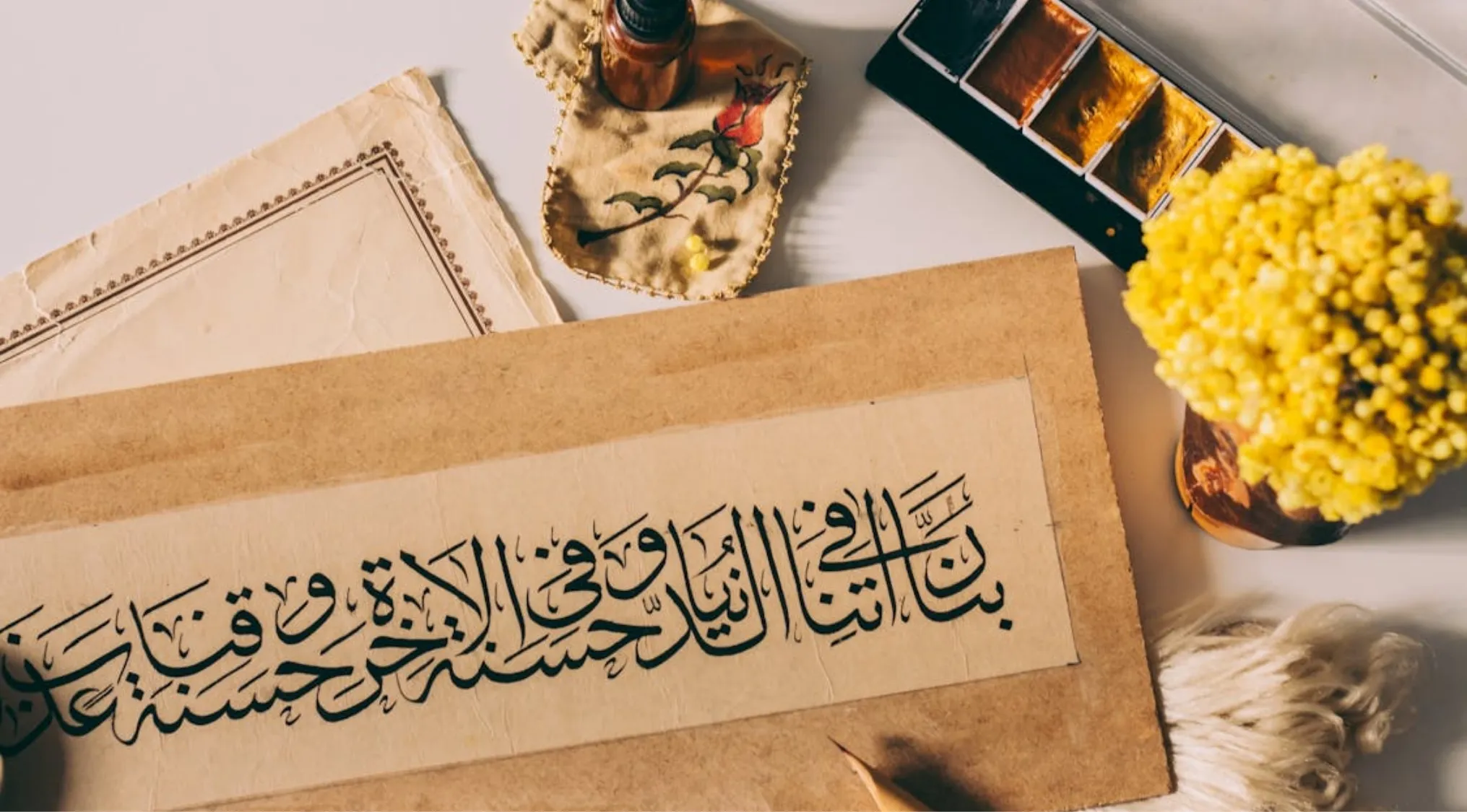 General Knowledge: Calligraphy on paper with ink, paint, and dried flowers. Art form of decorative handwriting.
