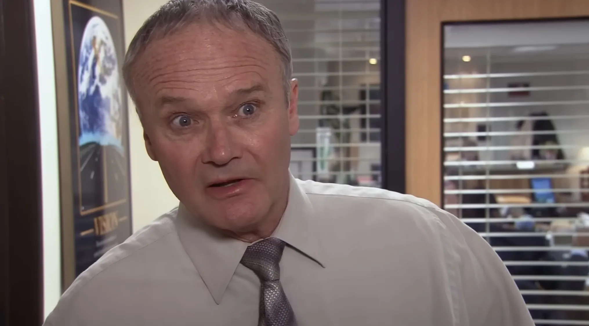 The Office Quiz image: Creed Bratton with a bewildered expression, posing a question about his role at Dunder Mifflin.