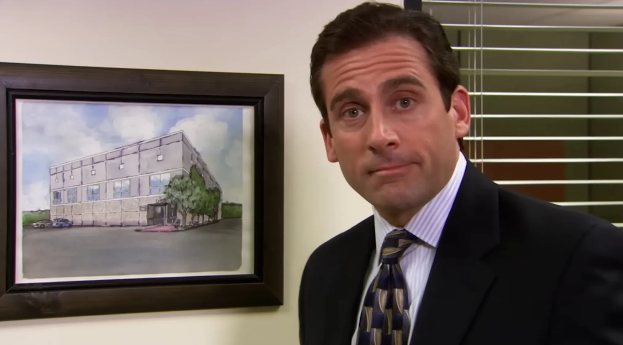 Michael Scott looking at the camera, with a painting of the Dunder Mifflin Scranton building. The Office Quiz.