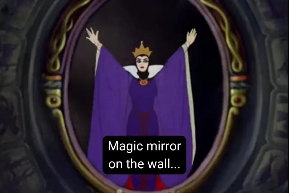 The Evil Queen reflected in a mirror, arms raised, asking the magic mirror what it says.