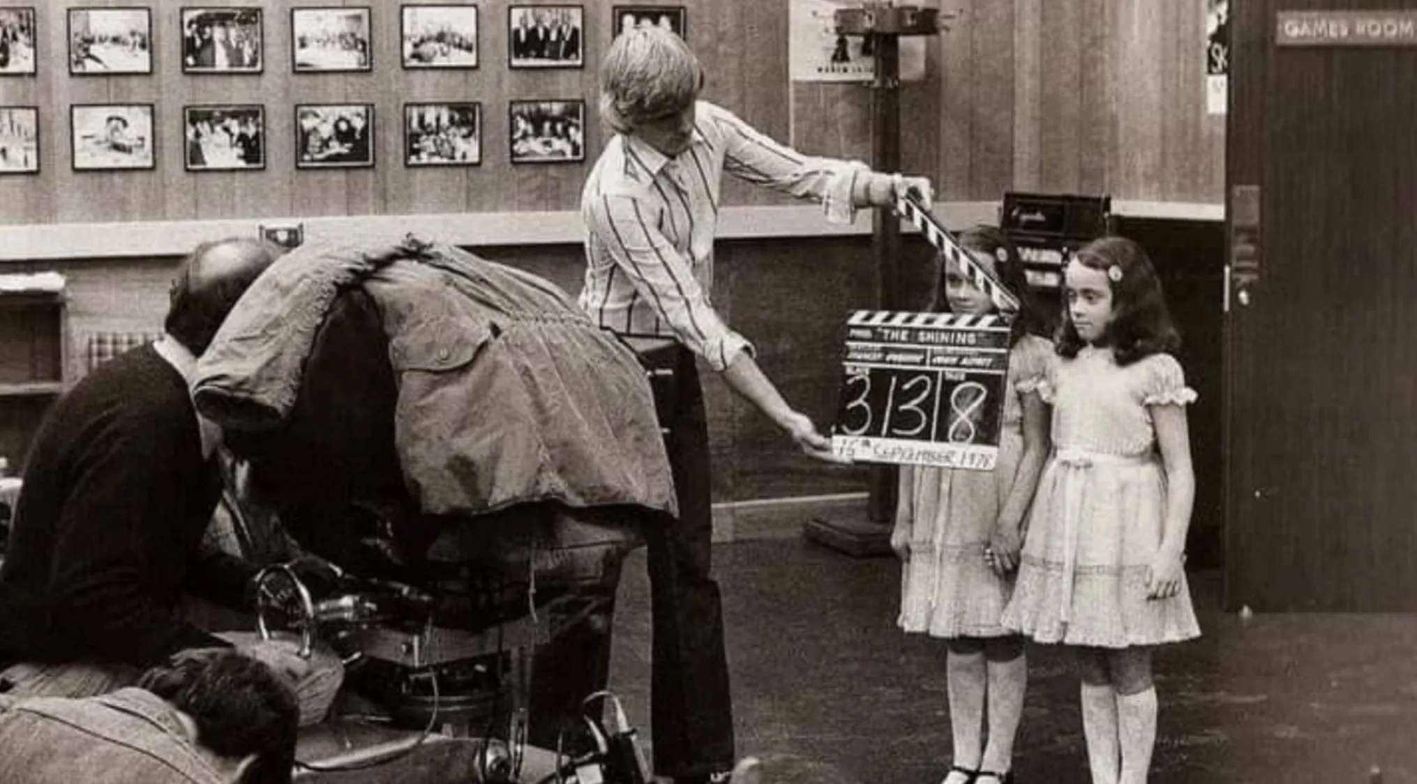 BTS image of Guess The Movie, The Shining, with crew and the Grady twins, captured during filming.