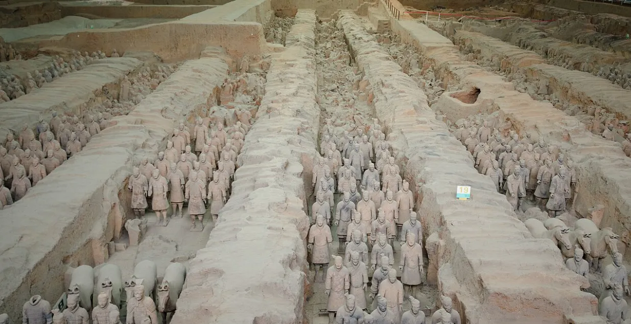 Rows of Terracotta Army warriors and horses in an excavated pit, showcasing their remarkable General Knowledge and historical significance.