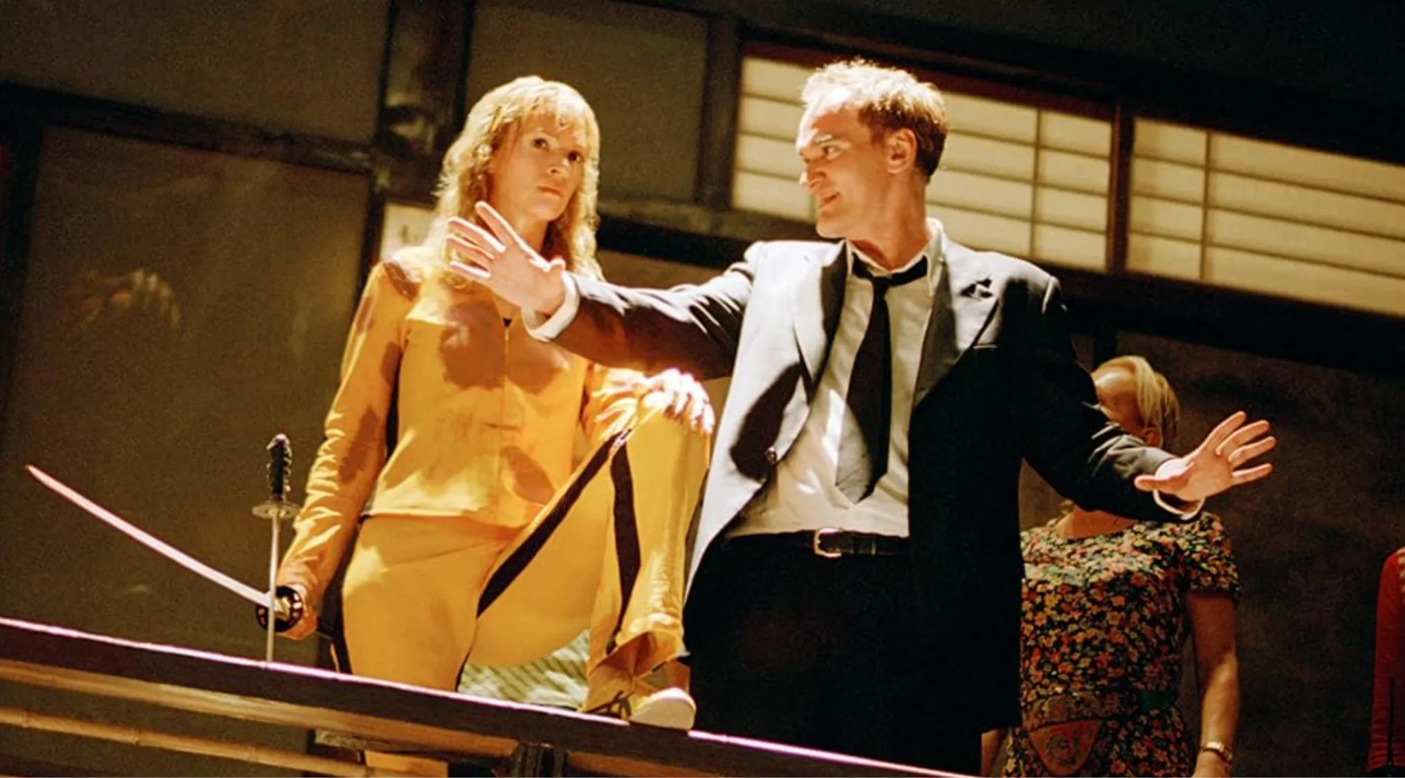 BTS image shows a film crew and actors in a martial arts scene, perfect for a movie guess.