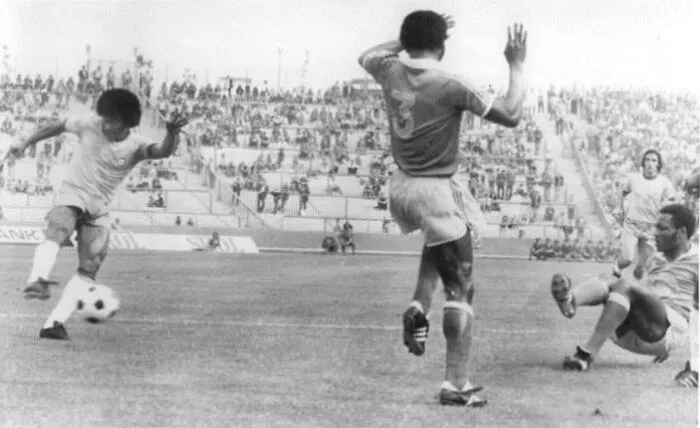 Black and white photo of a soccer match in progress, capturing a key moment from the year you were born.