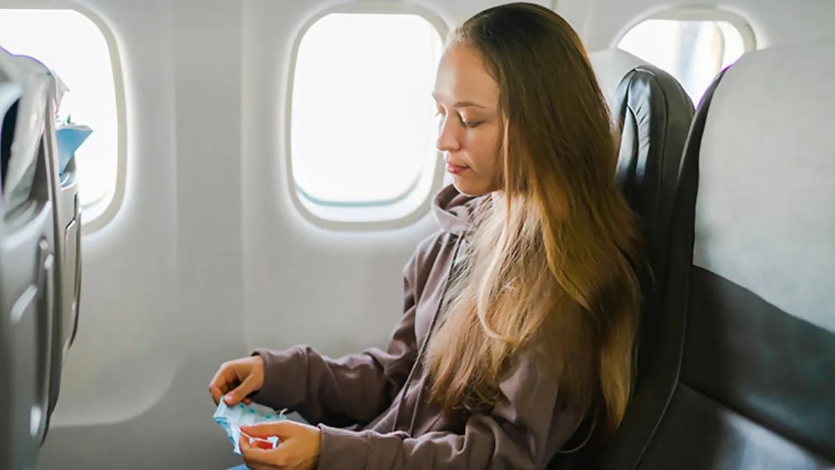 Woman Refuses To Move Her Hair On Plane, Dad Figures Out How To Make Her Super Uncomfortable