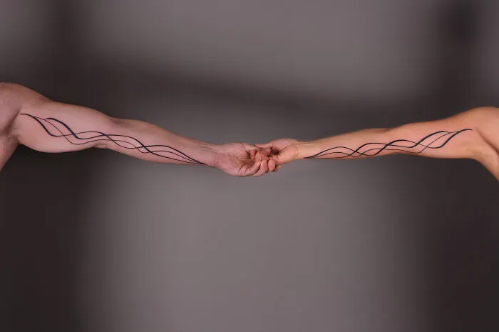 These 15 Couple Tattoos Blur The Line Between Two Individuals And One Design