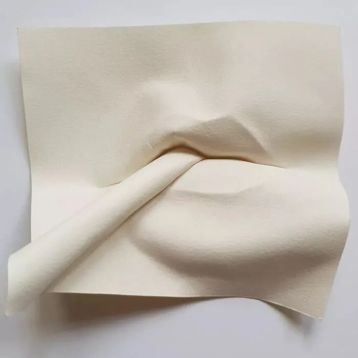 Face Emerging From The Paper