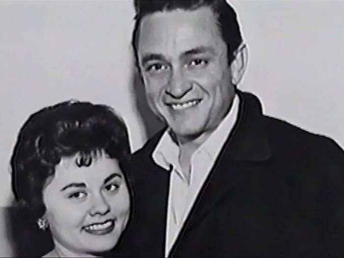 Black and white photo of a smiling couple, evoking creepy and mysterious feelings that people lose sleep over.