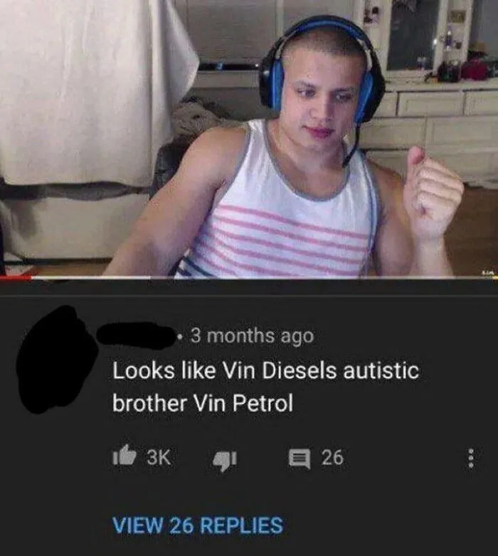 A man in a tank top and headphones, reacting to a savage burn in a YouTube comment section. Rare burns at their finest.