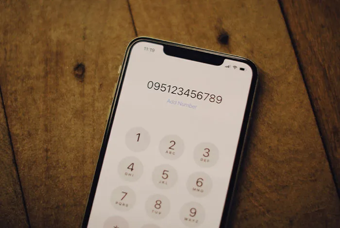 A smartphone displaying a long number on the dial pad, symbolizing exceptional intelligence, almost artificial in its capacity.