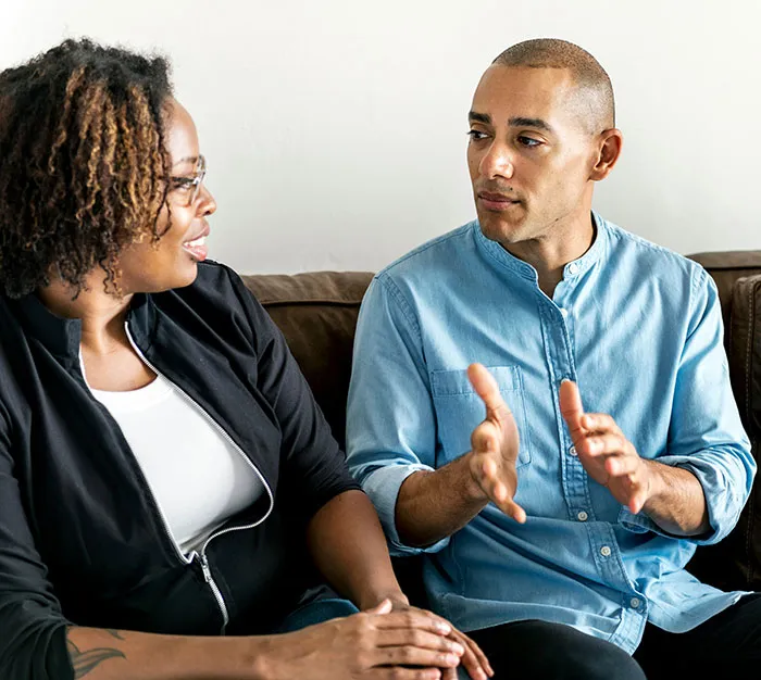 Two people engaged in a thoughtful conversation, demonstrating subtle and interesting displays of intelligence.