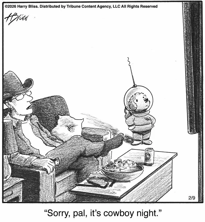 A humorous one-panel dog comic where a dog in a space helmet watches a man relaxing. Wholesome dog comics.