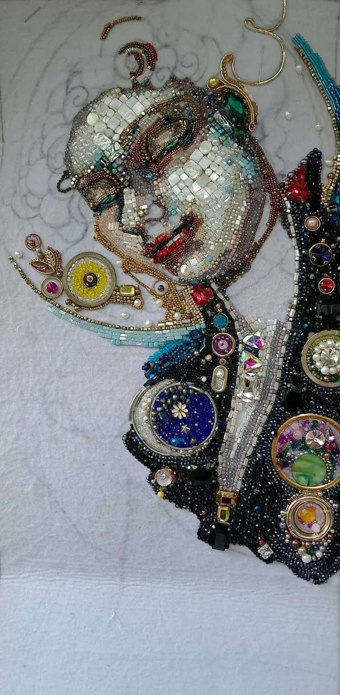 Detailed embroidery projects featuring a stunning mosaic portrait created with colorful beads