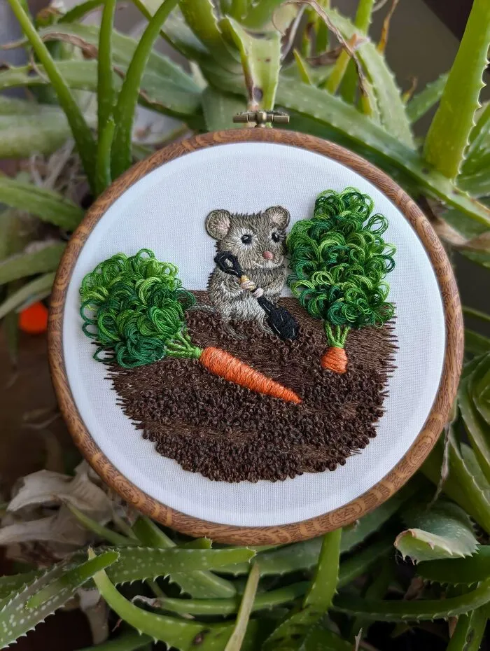 Charming embroidery projects depicting a cute little mouse holding a shovel next to a carrot in a hoop