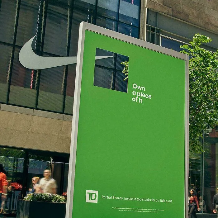 Minimalism ad with missing Nike logo piece on green TD investment billboard