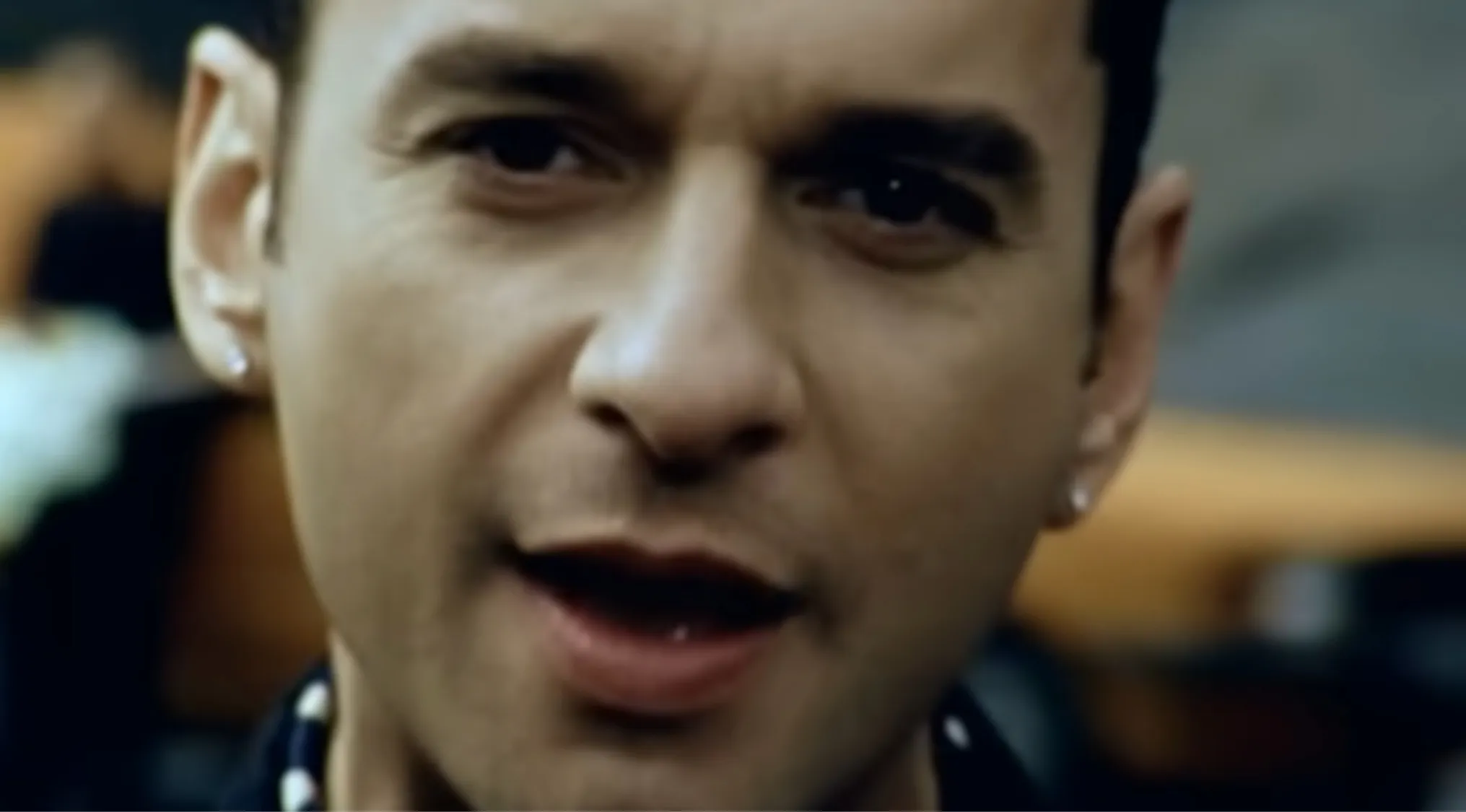 Close-up of Dave Gahan, lead singer, looking directly at the camera. Music Challenge: Name 30 Bands.