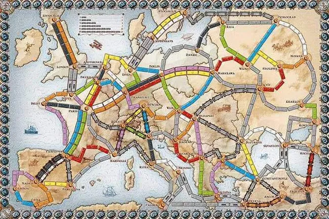 A Ticket to Ride game board showing a map of Europe crisscrossed with colorful train routes, a classic board game.