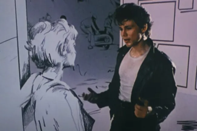 A-ha's Morten Harket as a live-action character in a leather jacket, talking to a sketched woman in the Take On Me music video, an 80s power ballad.