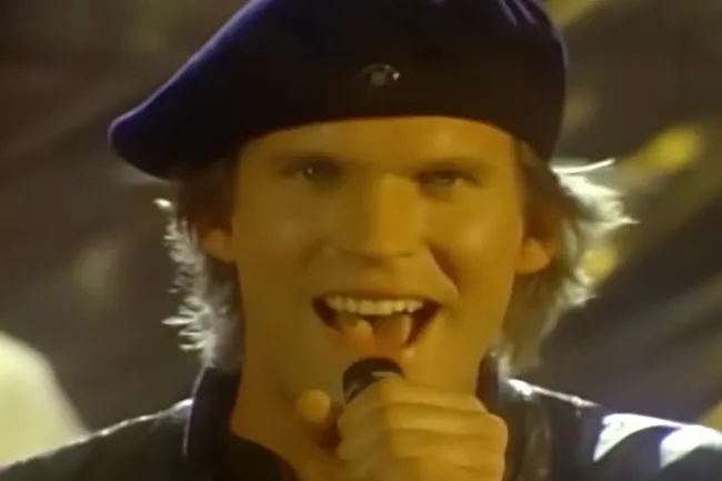 Survivor lead singer Dave Bickler performing Eye of the Tiger, a quintessential 80s power ballad.