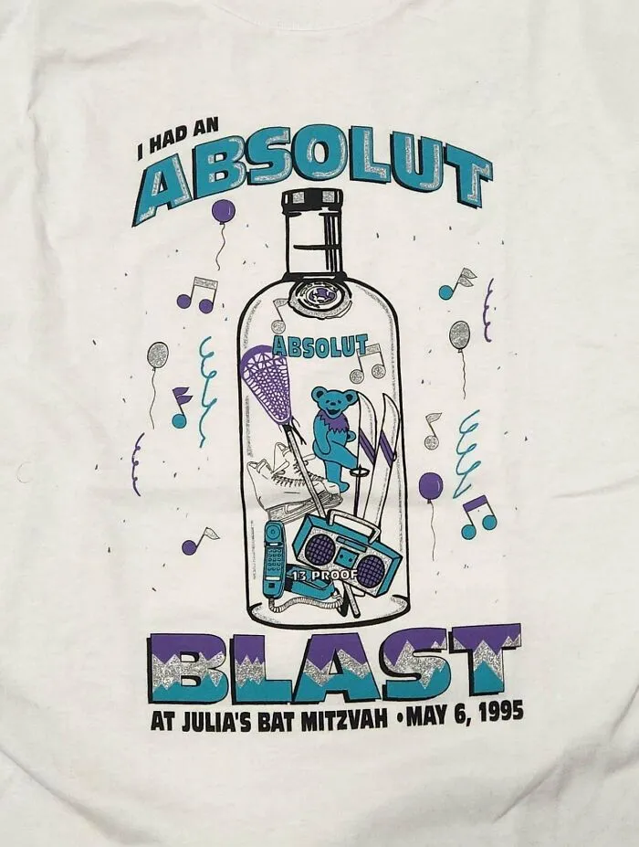 A white t-shirt features an Absolut Blast design for a bat mitzvah, a cool thrift store jackpot.