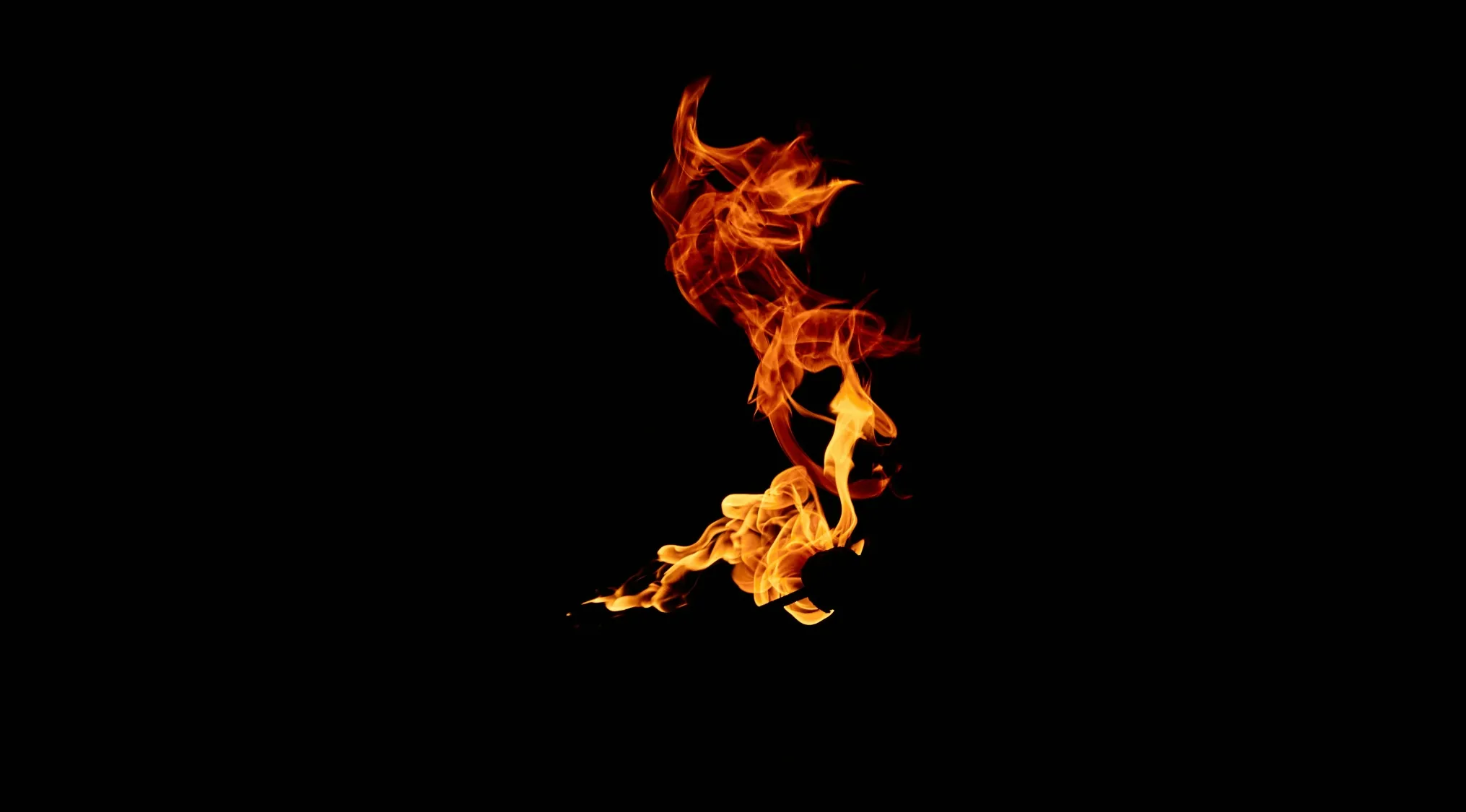 Vibrant orange and yellow flames against a black background, representing the essential gas for combustion.