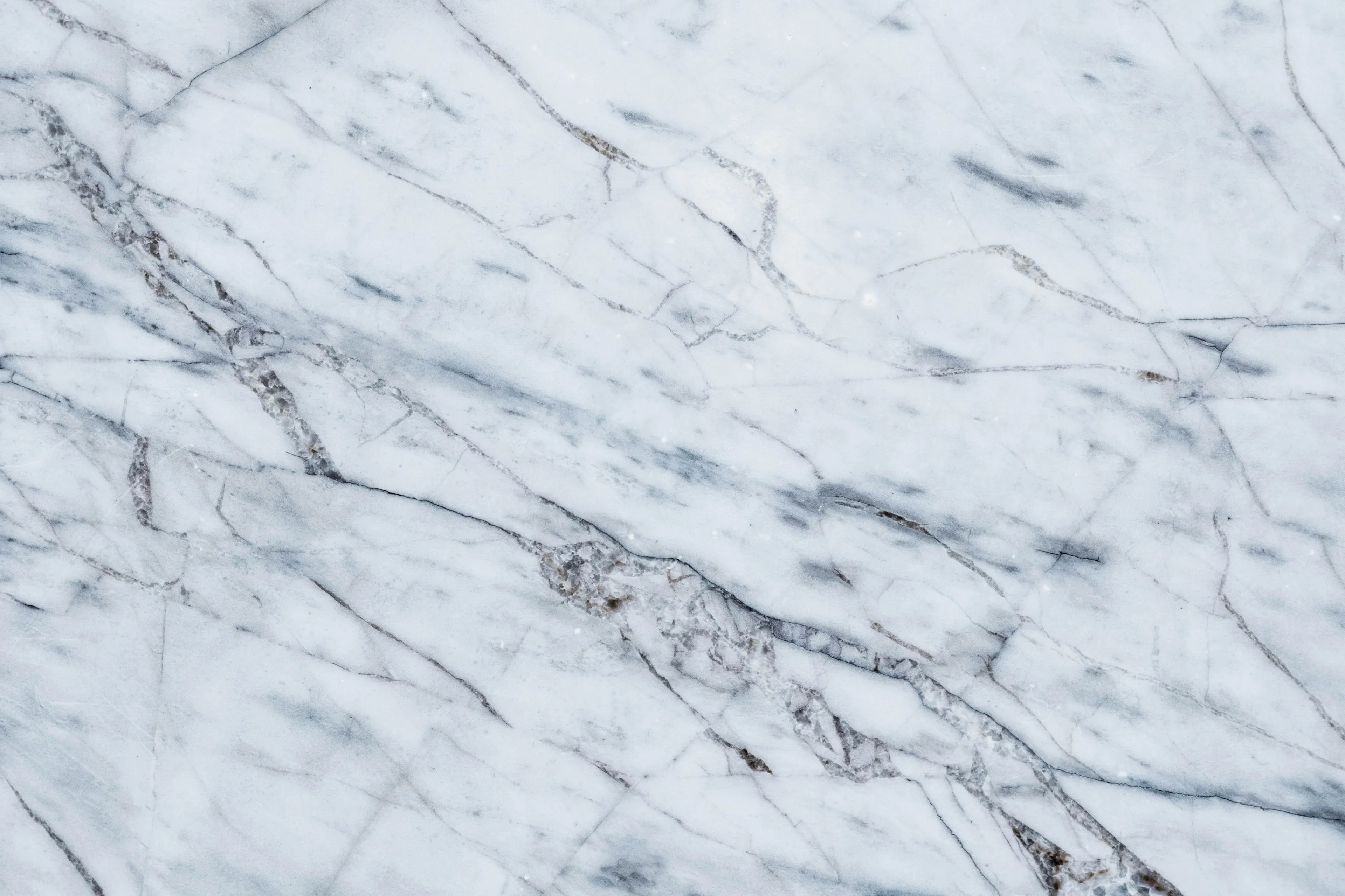 Abstract marble texture wallpaper, featuring intricate white and grey veining, perfect for a clean desktop background.