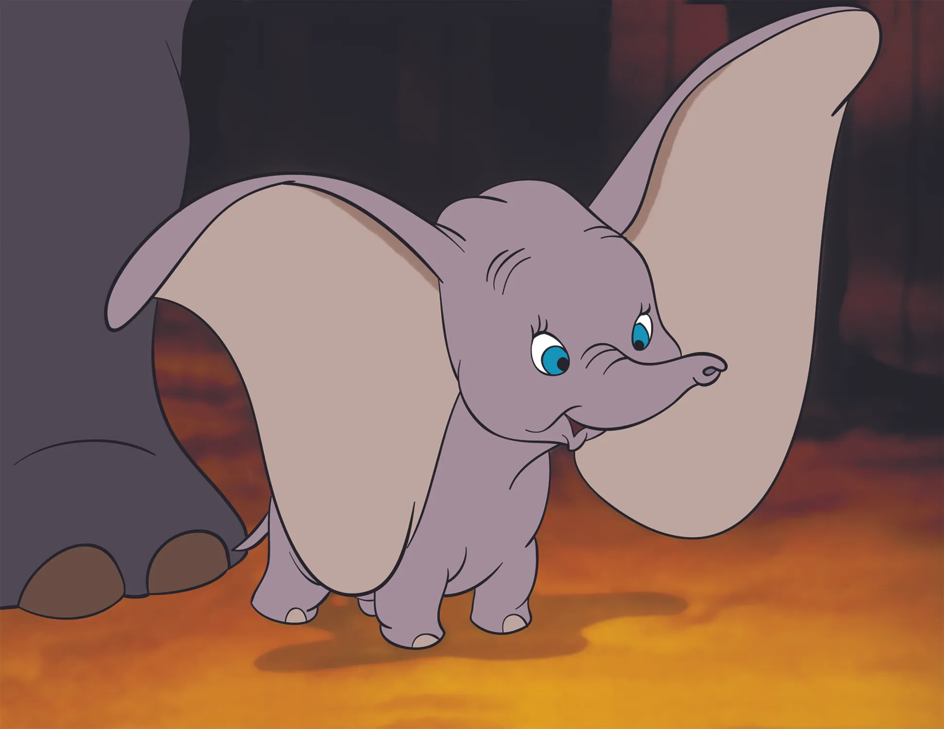 The animated character Dumbo, the baby elephant, with his large ears, standing next to a larger elephant.