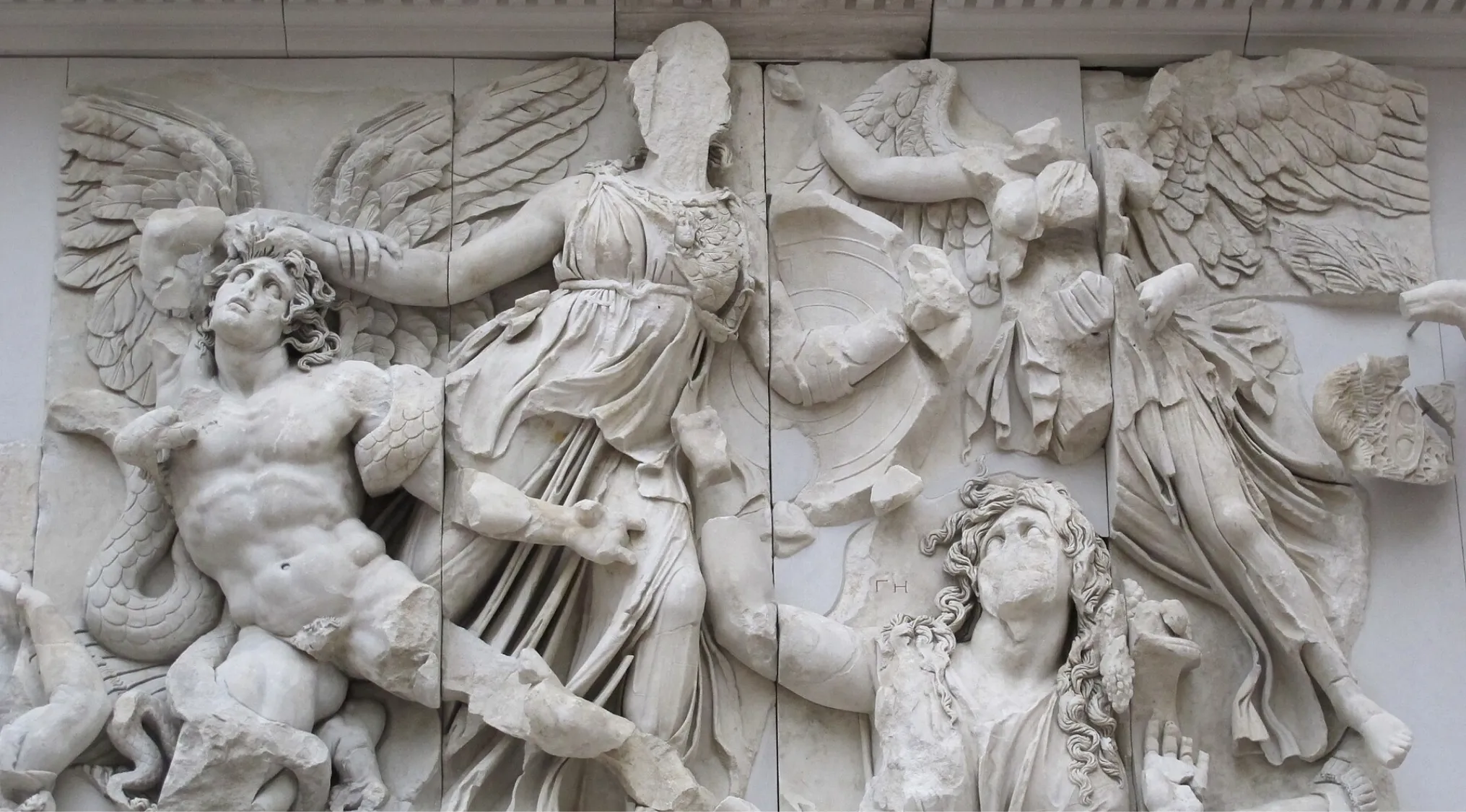 Ancient Greek mythology relief sculpture depicting figures, possibly the primordial goddess Gaea. Detailed marble artwork.