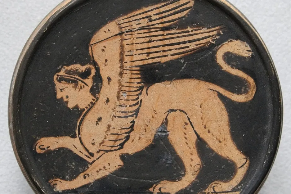 Ancient Greek pottery depicting a Sphinx, a mythological monster with a human head, lion body, and bird wings.