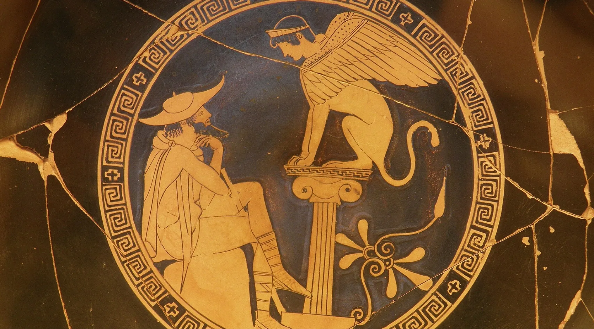 Ancient Greek pottery depicts a human figure conversing with a Sphinx, a monster with a lion body and human head.