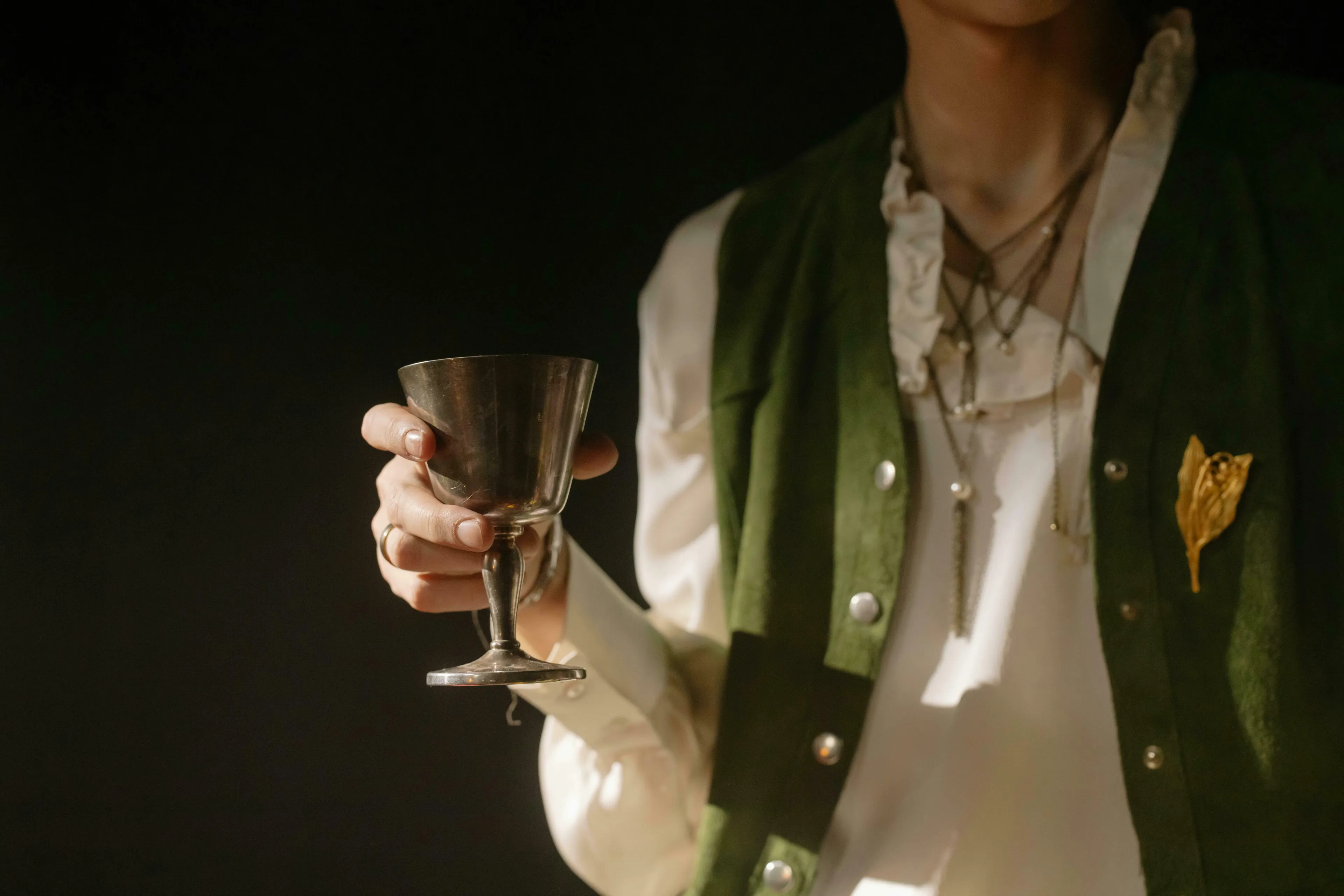 A person in Renaissance attire holding a silver goblet. Test your General Knowledge with this difficult quiz for High IQs.