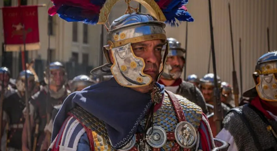 A Roman soldier in ornate armor and feathered helmet, part of a legion. Answer the General Knowledge Quiz!