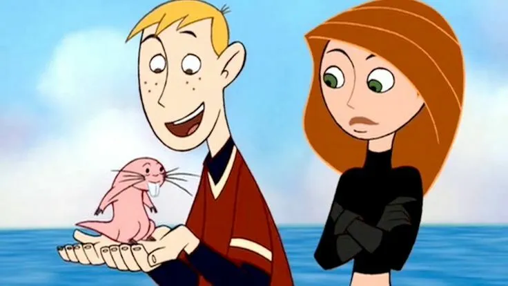Y2K Pop Culture Quiz: Kim Possible and Ron Stoppable, holding Rufus, against a blue background.
