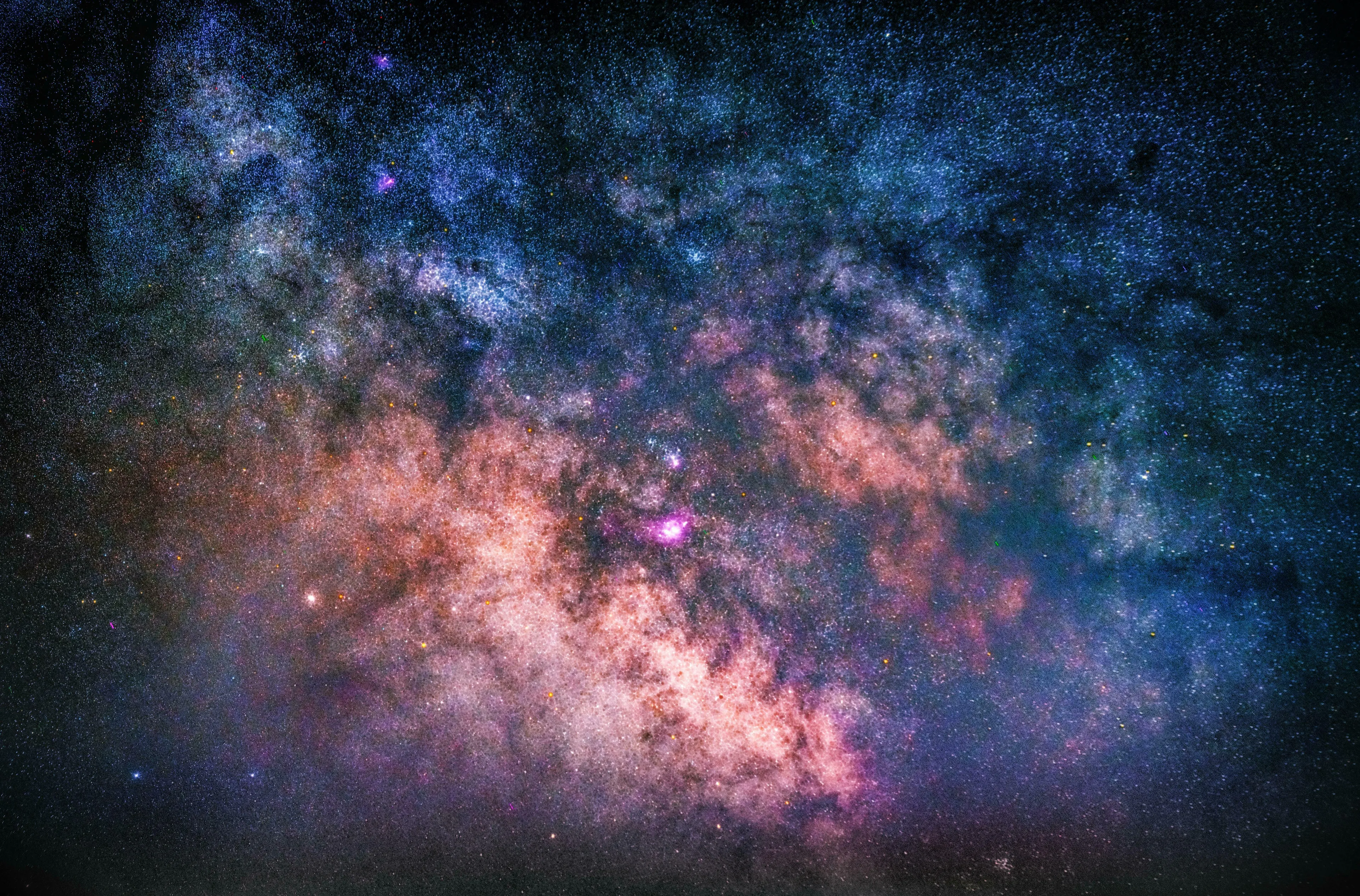 Stunning view of the Milky Way galaxy, filled with countless stars and colorful nebulae. Real or Fake Trivia for cosmic wonders.
