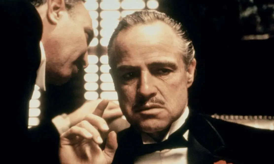 Marlon Brando as Vito Corleone in The Godfather, wearing a tuxedo. A film to watch tonight.