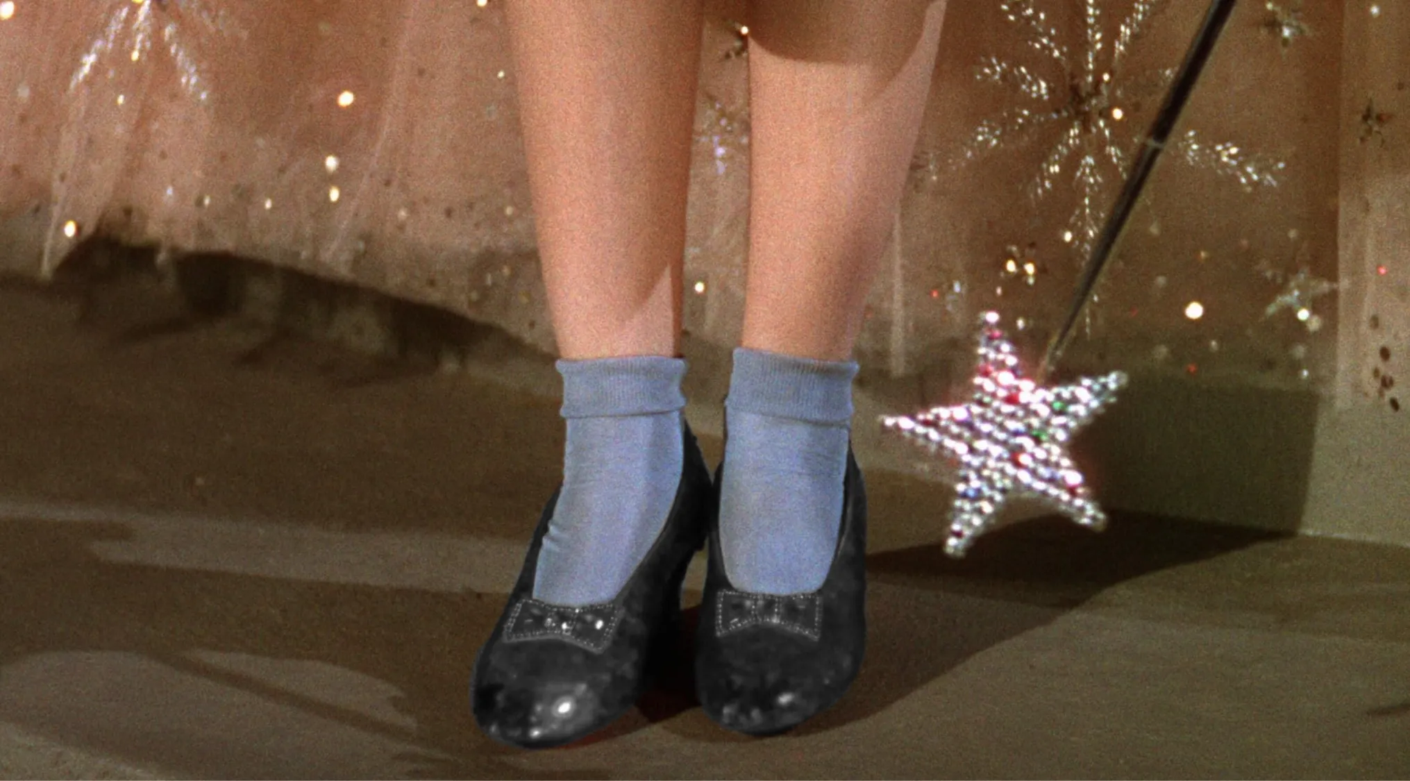 An image showing a pair of grey shoes